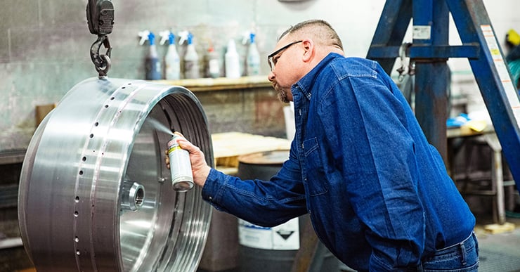 Separators employee repairs centrifuge bowl